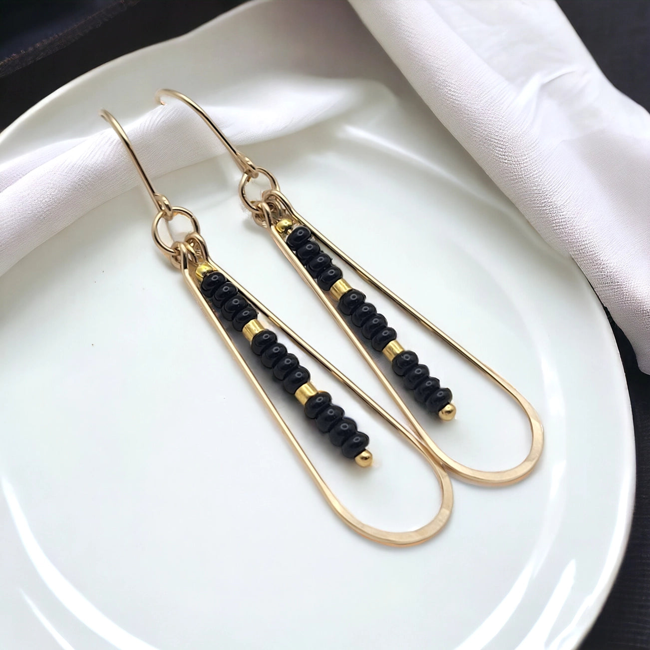 Long Gold Teardrop Hoop Earrings with Black Seed Beads