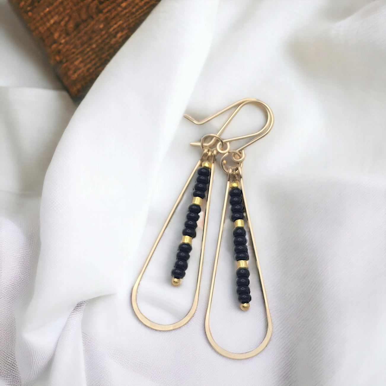 Long Gold Teardrop Hoop Earrings with Black Seed Beads